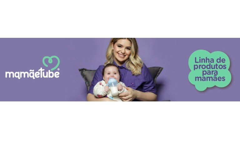 Viih Tube encantadoramente segura a filha Lua Tube, exibindo produtos encantadores da Loja da Lua Tube para bebês.